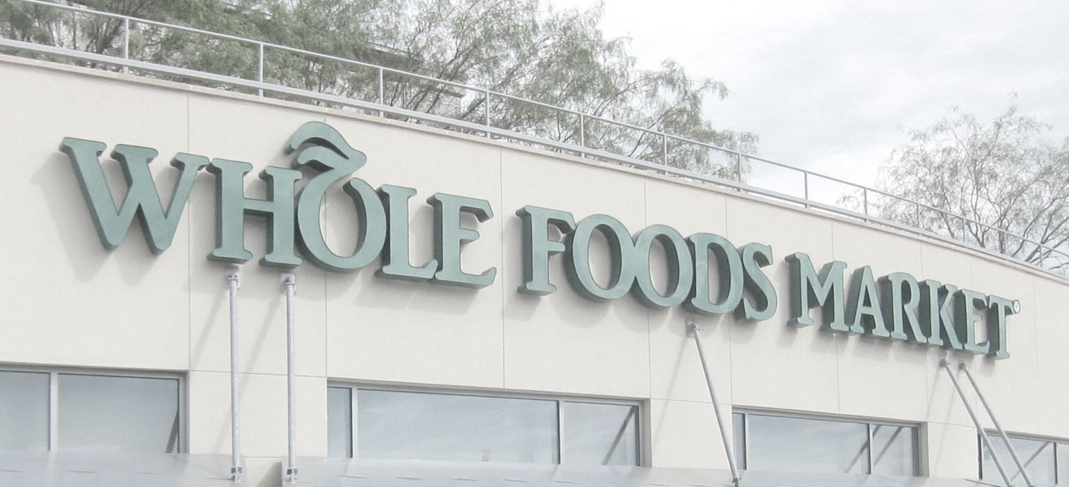 A Whole Foods Market sign is an example of descriptive brand name